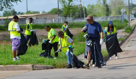 Arthur F. Smith students collecting trash.