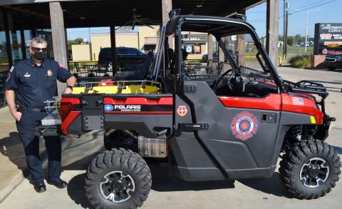 Alexandria Fire Department EMS Director Jason Hebert displays the EMS ATV purchased with funds from a $29,000 grant during a press briefing Tuesday morning at Firehouse Subs on MacArthur Drive. The Firehouse Subs Public Safety Foundation awarded The Alexandria Fire Department a grant of more than $29,000 to purchase an EMS ATV. The customized Polaris ATV will be used for outdoor events as well as search and rescue missions.